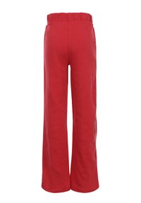 Rode wijde broek met elastische tailleband, gemaakt van zachte stof, met een gladde textuur en een eenvoudig ontwerp zonder extra details.
