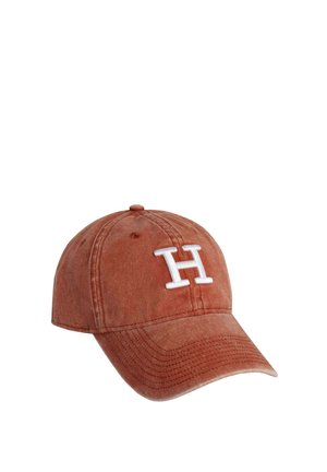 Rust-colored baseball cap with white embroidered "H" logo, soft fabric, curved brim, and adjustable strap at the back.