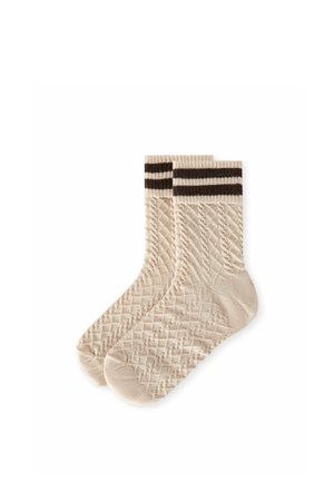Paire de chaussettes beige tricotées avec des motifs torsadés et en losanges et deux rayures brun foncé au niveau du haut du bord-côte.