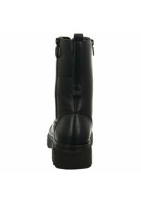 Bottines en cuir noir avec un bout rond, fermeture éclair à l'arrière et semelles texturées. Comprend une petite boucle à l'arrière pour un enfilage facile.