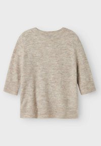 Beige kortärmad tröja med en mjuk och texturerad yta. Har en ribbad halsringning och nederkant, designad för en avslappnad passform. Inga synliga mönster.