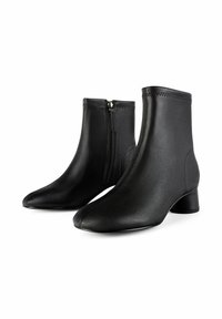 Schwarz ankle boots aus glattem synthetischem Material mit spitzer Zehe, seitlichem Reißverschluss und einem niedrigen Blockabsatz. Strukturiertes Nähen.