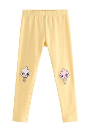 Gule leggings med elastisk linning med kawaii-stil hvide og pink isvaffel-patches på knæene.