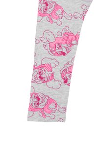 Leggings grigi con una stampa ripetuta di cuccioli di cartone in contorni rosa, che mostrano espressioni giocose e accessori.