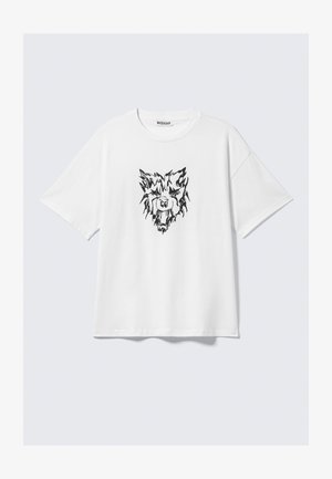 Hvid bomuld t-shirt med et sort grafisk tryk af et løvehoved på fronten. Afslappet pasform med korte ærmer og rund halsudskæring.