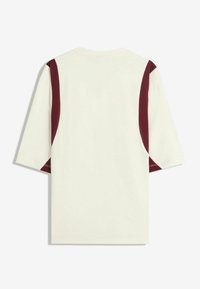 Short-sleeve t-shirt, cream fabric with maroon accents along the shoulders, casual fit, and smooth texture.
