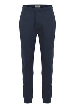 Temno modri trenirki iz teksturirane tkanine, z elastičnim pasom in vrvico, rebrastimi manšeti ter stranskimi žepi.