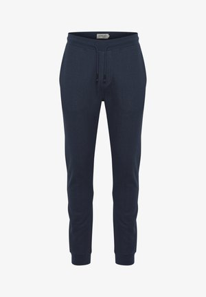 Pantaloni della tuta blu navy realizzati in tessuto texturizzato, con cintura elastica e cordoncino, polsini a costine e tasche laterali.