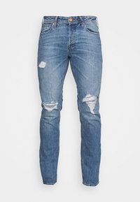 Jeans skinny de ganga azul claro com detalhes desgastados, apresentando rasgões nos joelhos, cintura padrão e design clássico de cinco bolsos.