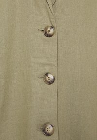 Olive green fabric with a smooth texture, featuring three round, patterned buttons and a notch collar design.