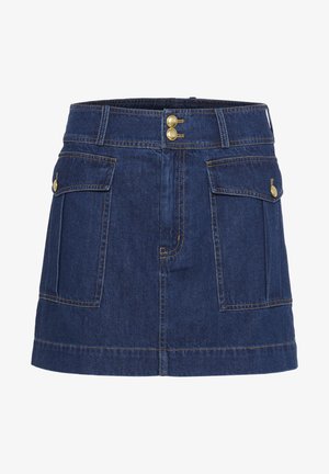 Jeanskjol i mörkblått med två framfickor, knäppningar i mässing och kontrasterande sömmar. Har en rak skärning och nederkant.