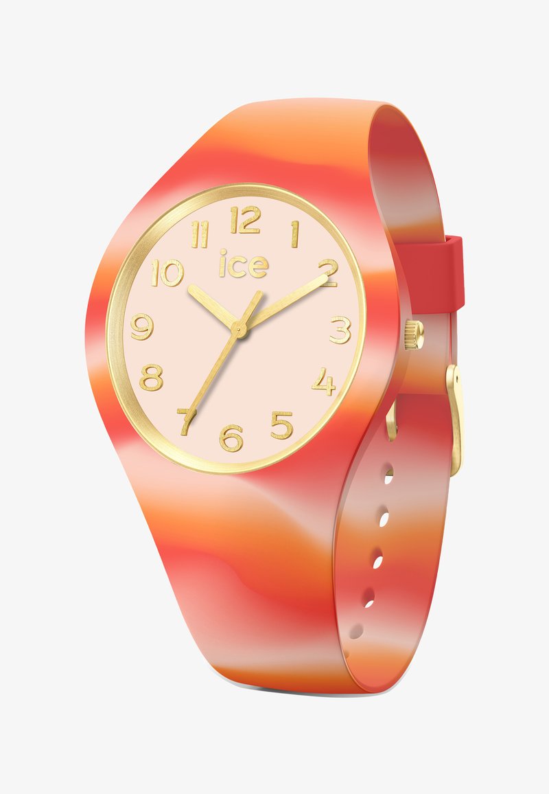 Krāsains pulkstenis ar gradienta oranžu un sarkanu silikona siksniņu. Apaļā sejas daļa ir ar gaiši rozā fonu un zeltainiem stundu rādītājiem un rokām.