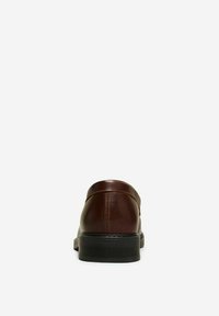 Brown leather slip-on shoe with a rounded toe, smooth texture, and a black rubber sole. Minimalist design with no visible hardware.