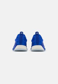 Blue training shoes with a textured mesh upper, white midsole, and prominent heel tabs. Features branding on the heel and a padded collar.
