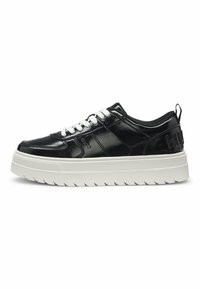 Black patent leather sneaker with white laces, featuring a thick ridged sole and embossed logo on the heel. Low-top design with round toe.