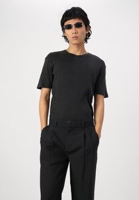 Jack & Jones JPSTBILL JJDAYTONA WIDE - Trousers - black