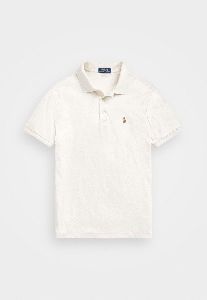 Kortärmad polotröja i off-white, tillverkad av bomull. Har en krage, treknappars knäppning och en liten broderad emblem på bröstet.