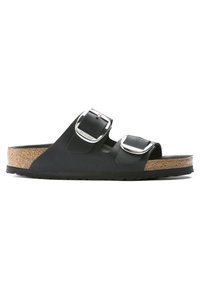 Sandales noires à semelles plates avec deux boucles réglables, semelle en liège et semelle extérieure texturée. Design simple avec une forme profilée et une finition mate.