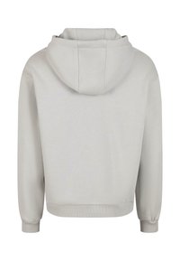 Ljusgrå hoodie med långa ärmar, ribbade muddar och ribbad fåll, sedd bakifrån på en vit bakgrund.