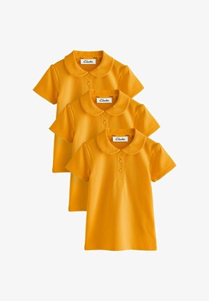 Drie gele polo's met korte mouwen, afgeronde kragen en knoopsluitingen, overlappend gerangschikt tegen een witte achtergrond.