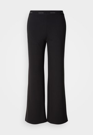 Crne zvonaste hlače od mekanog tkanja s širokim pojasom na kojem je logotip Calvin Klein. Glatka tekstura, dizajn punog duljine.