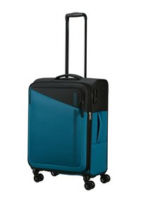 Valigia rigida in turchese e nero, dotata di manico retrattile, quattro ruote, chiusura a zip e un design testurizzato con linee di accento.