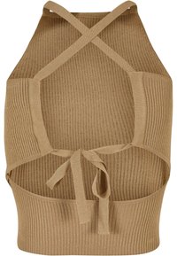 Crop top beige en maille côtelée sans manches avec bretelles croisées et détail noué dans le dos.