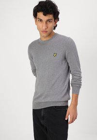 Tommy Jeans ISAAC TAPERED - Relaxed fit jeans - denim black