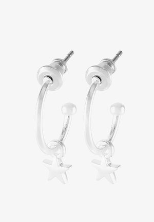 Silver hoop earrings with a star charm, featuring a polished finish and curved design, secured with a post backing.