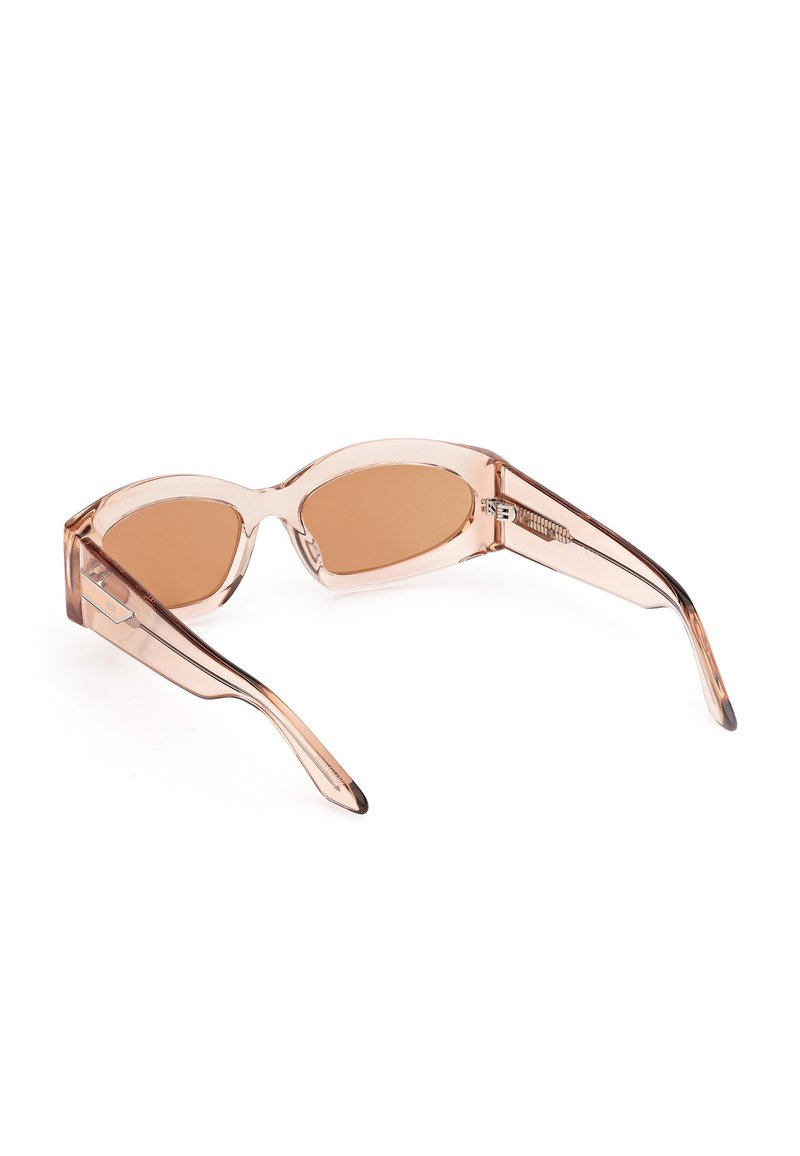 Rose-tinted sunglasses with a transparent frame, elongated oval lenses, and sleek angular arms. Features subtle hardware accents.