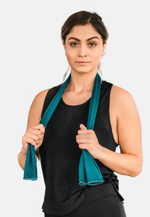 Athlete wearing a black mesh tank top, holding two teal resistance bands. Features a loose fit and breathable texture for comfort.