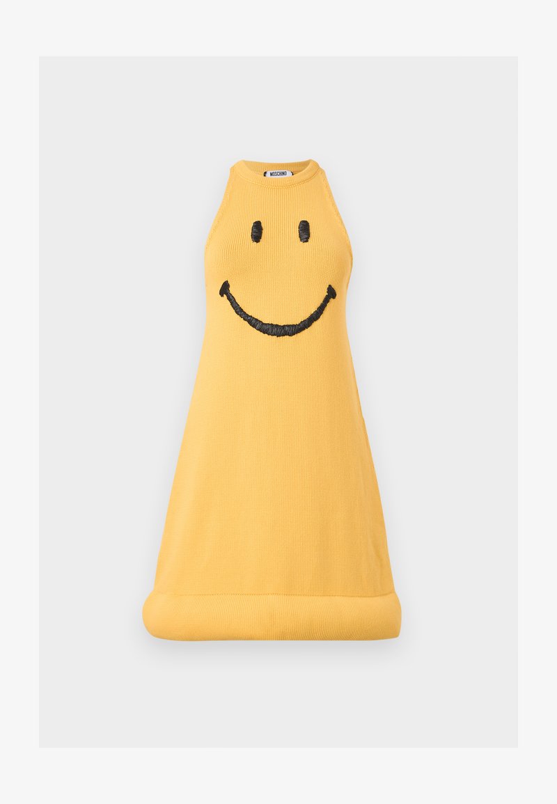Yellow sleeveless knit dress with black embroidered smiley face on the front and a rolled hem, Moschino brand label visible inside collar.
