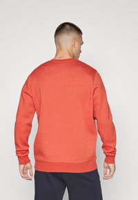 Under Armour ICON FLEECE - Sudadera - earthen orange/light heather