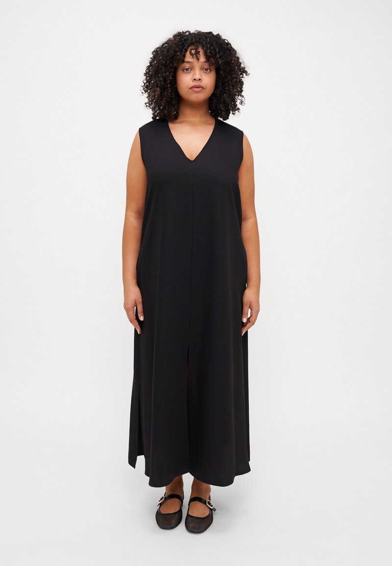 Black sleeveless maxi dress with a V-neck, featuring a front slit and a flowy A-line silhouette, made from lightweight fabric.