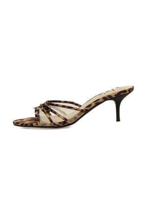 Mules de tacón alto con estampado de leopardo y diseño transparente, que cuentan con un detalle anudado en la parte delantera y un delgado tacón de aguja.