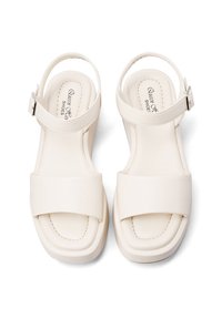 Sandali bianchi in pelle con ampie fibbie anteriori, cinturino alla caviglia regolabile, soletta imbottita e design con tacco basso e spesso.