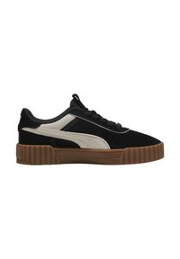 Zapatillas de ante negras y crema con suela de goma texturizada, que presentan una franja blanca suave y cordones gruesos. Punta redondeada y cuello acolchado.