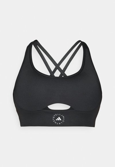 Mαύρο αθλητικό σουτιέν με λεπτομέρεια κοπής κάτω από το μπροστινό μέρος, διαθέτει σταυρωτές τιράντες και εκτυπωμένο λογότυπο στο κέντρο κάτω.