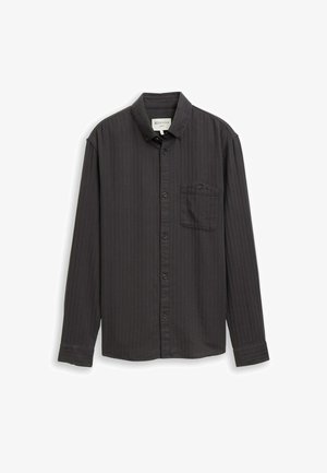 Maglietta a maniche lunghe grigio scuro con strisce verticali, colletto abbottonato, taschino frontale e chiusura con bottoni frontali. Tessuto in cotone morbido.