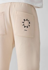 smALLSAINTS REGULAR FIT - TIERRA CUFFED LOGO JOGGERS - Træningsbukser - neutral