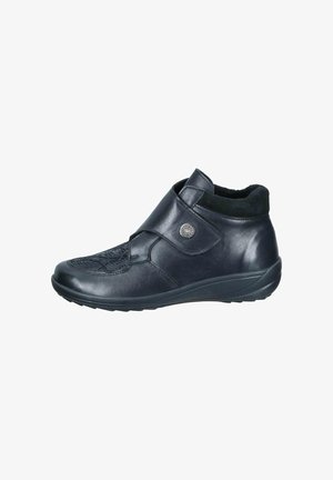 Black leather ankle shoe with velcro strap and decorative button, textured front panel, and cushioned sole.