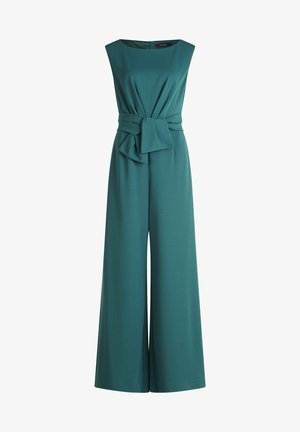 Teal jumpsuit with a fitted bodice, wide legs, and a knotted waist detail. Made from soft, stretchy fabric with a boat neckline and zipper back.