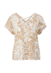 Blouse à manches courtes avec un motif abstrait de feuilles beige et blanc, et un col en V orné de fines bretelles croisées.