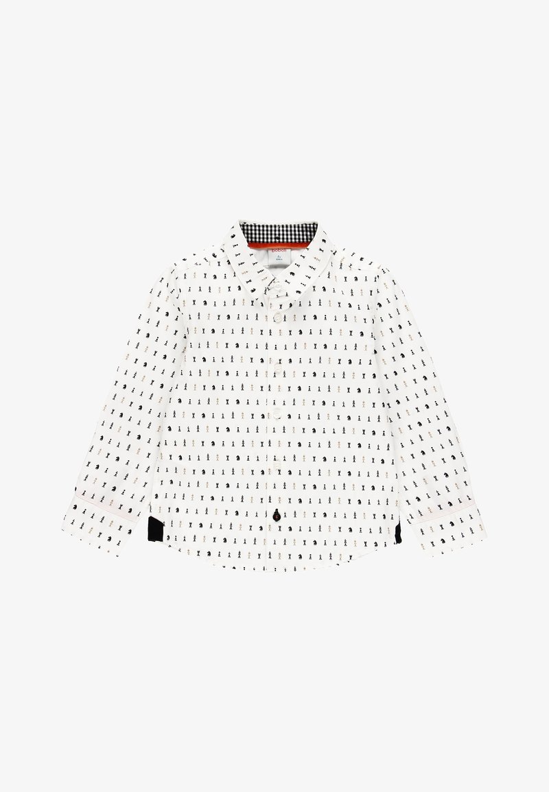 Chemise blanche à manches longues avec un motif répétitif noir et or, dotée d'un devant à boutons, d'un col à carreaux contrastant et de détails noirs.
