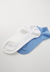 Cotton ankle socks in white and light blue, featuring a smooth texture and low-cut design. Each sock has a contrasting cuff and logo detail.