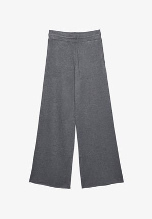 Graue weit geschnittene Hose aus weichem Strickmaterial, mit einem elastischen Bund und Kordelzug für eine verstellbare Passform.
