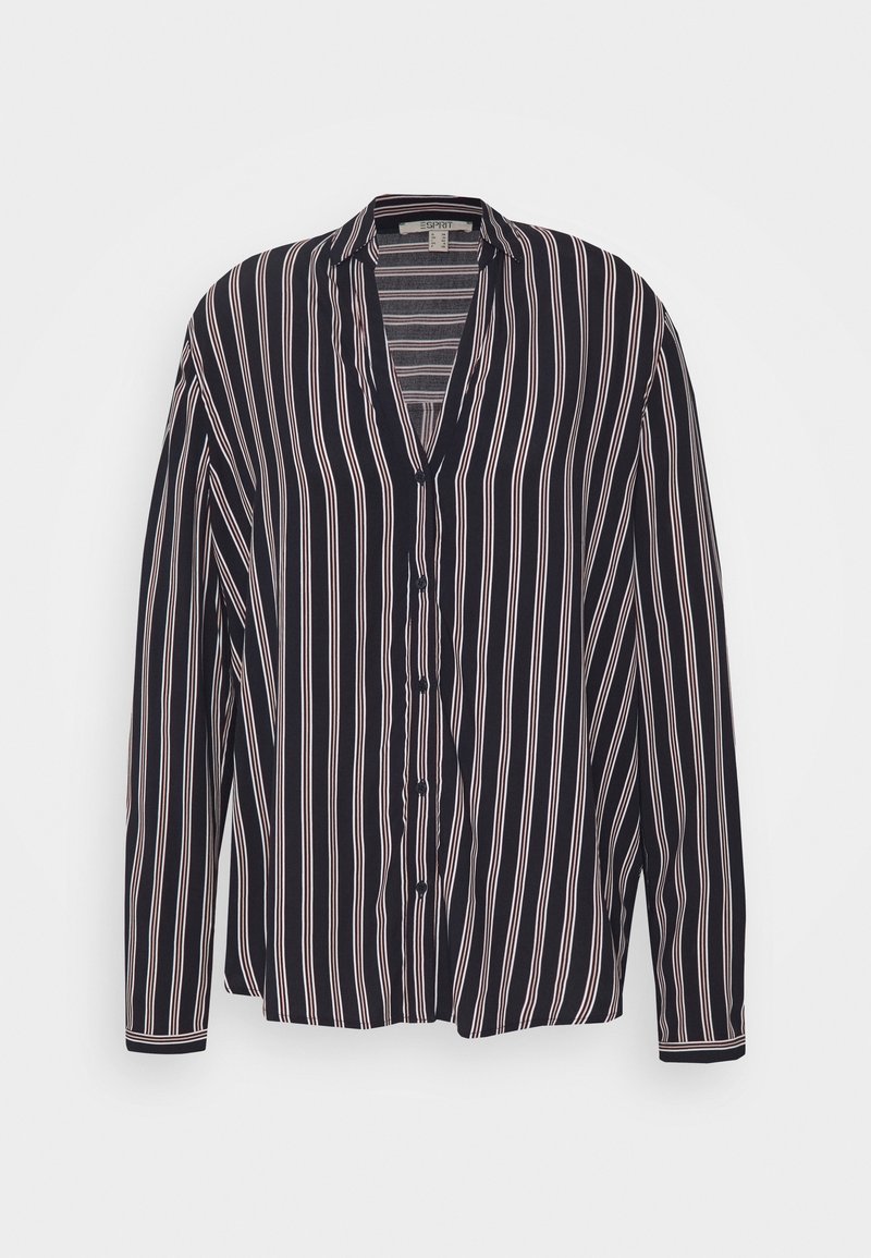 Blouse noire à boutons avec des rayures verticales blanches et rose pâle, col en V, manches longues, présentée sur un fond uni.