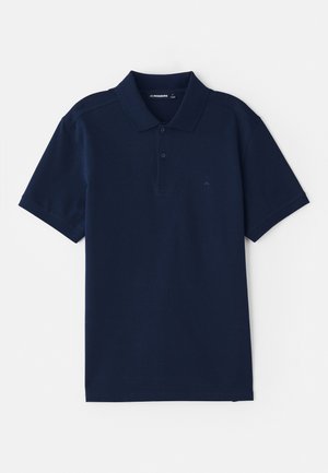 Polo en coton mélangé bleu marine, avec un col classique, une patte de boutonnage à trois boutons et des manches courtes. Logo subtil sur la poitrine.