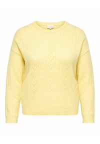 Pull en tricot jaune à manches longues avec des motifs ajourés en forme de cœur, des poignets et une bordure côtelés, et un col rond.