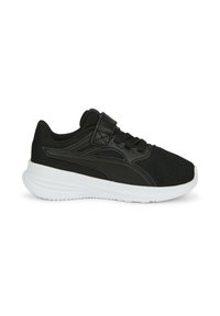 Scarpa sportiva nera con tomaia in mesh testurizzato, lacci piatti e fascia in velcro, dotata di suola in gomma bianca a contrasto.